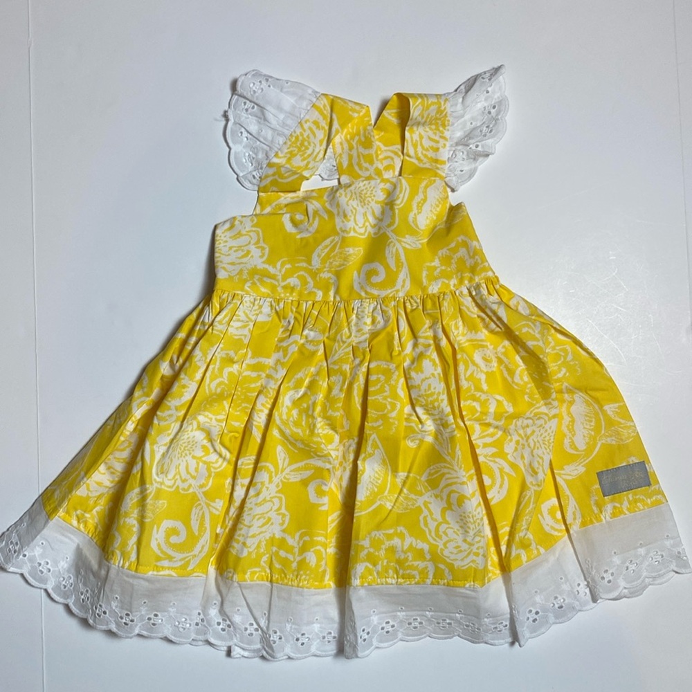 Yellow sleeveless dress with eyelet trim
